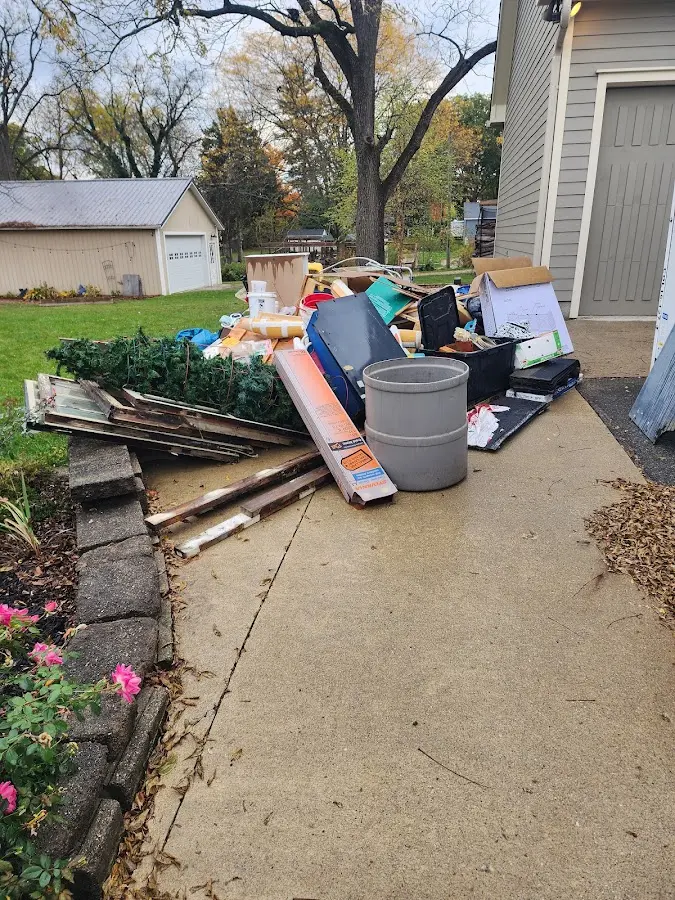 Dumpster being loaded with debris for 10 Yard Dumpster Rental in Oregon